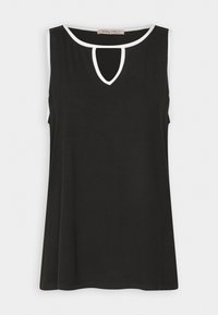 Top noir sans manches avec un décolleté en forme de trou de serrure, bordé de blanc. Tissu doux, coupe décontractée, ourlet droit, et sans motifs ni accents supplémentaires.