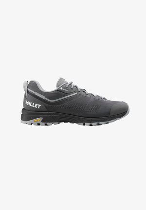 Gray Millet hiking shoe with Gore-Tex fabric, Vibram sole, and pull tab, designed for outdoor and trail activities.
