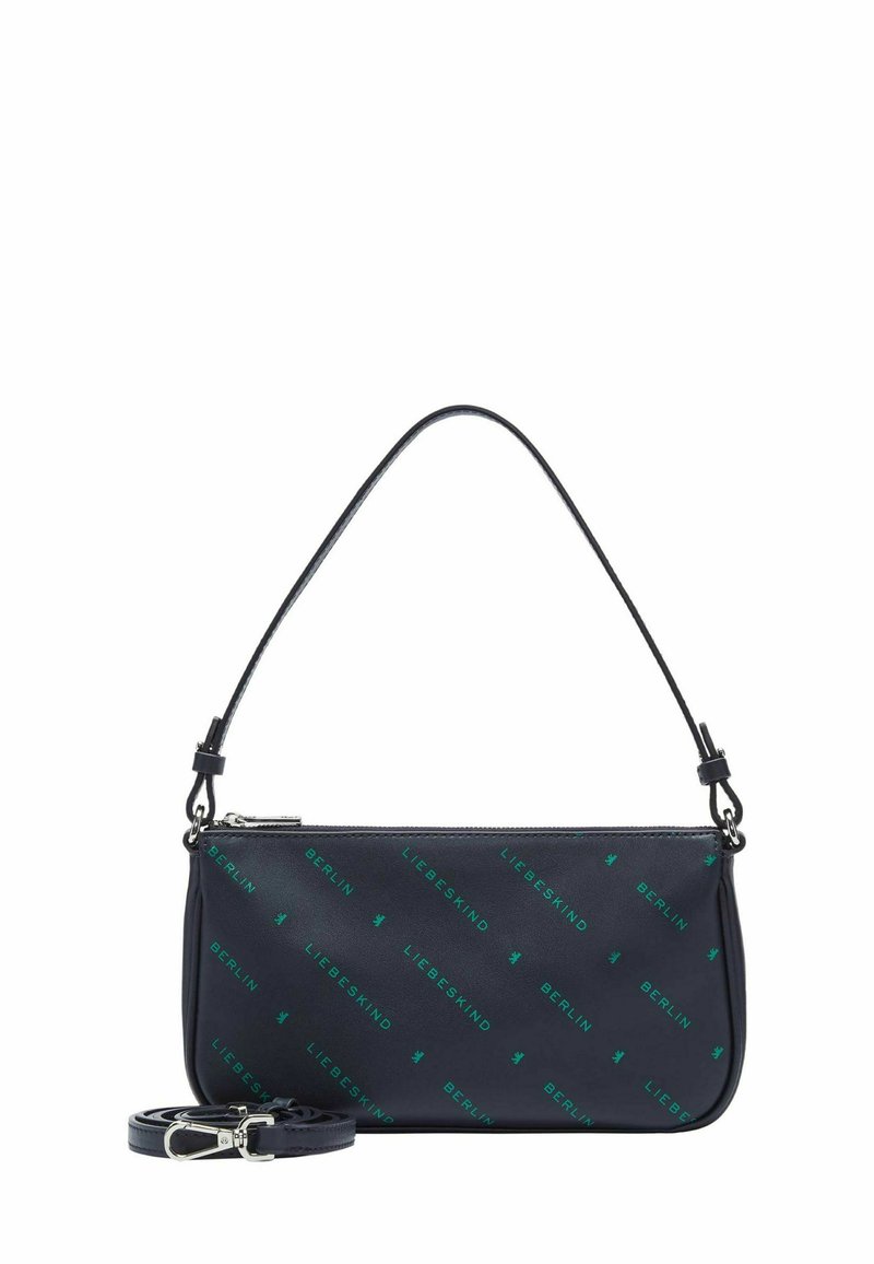 Sac à main en cuir bleu marine avec fermeture éclair, comportant un motif de logo vert répétitif. Inclut une bandoulière amovible.