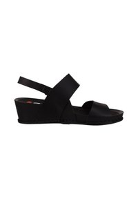 Sandalias de cuña negras con tiras cruzadas y un soporte trasero. Material sintético suave, punta redondeada y suela texturizada. Tacón bajo.