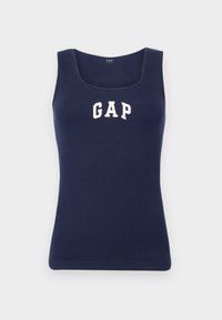 Canotta a coste blu navy con scollatura quadrata e spalline spesse. Presenta il logo bianco "GAP" centrato sul petto. Tessuto morbido, design aderente.