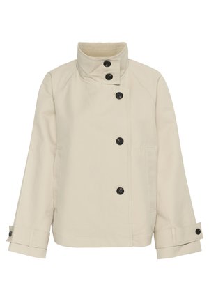Beige jacka tillverkad av mjukt material, med hög krage, sex svarta knappar, sidofickor och rak skärning med uppvikta ärmar.