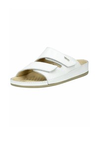 White slide sandal with an open toe design, featuring two adjustable Velcro straps and a textured insole for comfort. Flat rubber sole.