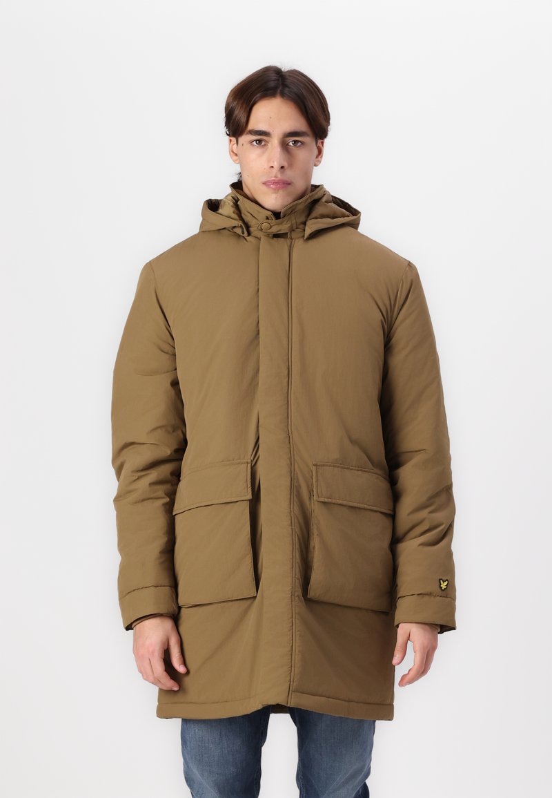 Bruine gewatteerde parka met een professionele rits aan de voorkant, twee grote zakken en een textuurstof. Voorzien van warme isolatie en een logo op de mouw.