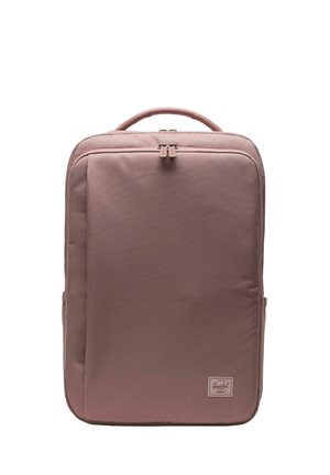 Sac à dos rectangulaire mauve avec poignée supérieure, poche zippée à l'avant et un petit écusson logo Herschel en bas à droite.