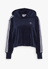 Marinblå kort hoodie i mjukt tyg med vitt Adidas-logotyp och tre vita ränder som löper längs varje ärm. Har en justerbar huva.