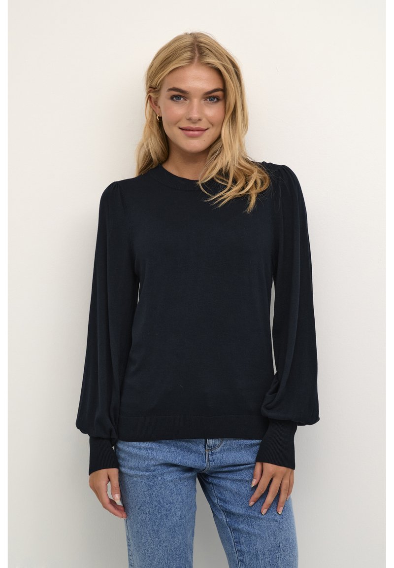 Navy blue pullover sweater featuring long, puffed sleeves, ribbed cuffs and hem, and a round neckline, made of soft, lightweight material.
