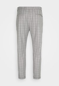 Grå rutiga byxor med smal passform, med sidofickor, dragkedjestängning och ett lätt texturerat tyg. Uppvikt fålldetalj.