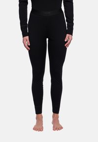 Legging noirs au design ajusté, avec une taille plate arborant le logo de la marque, une texture lisse et des poignets à la cheville.