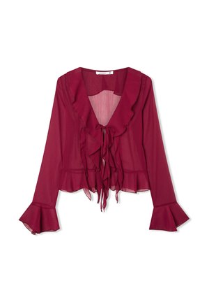 Blusa bordeaux con maniche lunghe, scollo e orlo arricciati, chiusura con lacci frontale e polsini svasati. Realizzata in tessuto leggero e trasparente.