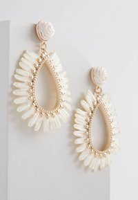 Next Pendientes - bone