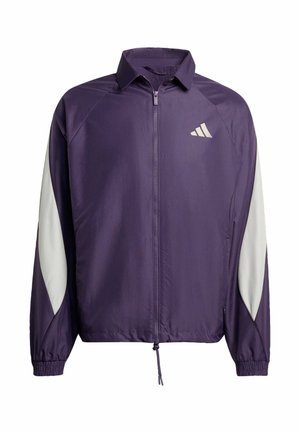 Veste violette avec des accents blancs, fermeture éclair à l'avant, col, poignets élastiques et ourlet à cordon de serrage. Logo sur la poitrine. Tissu léger et lisse.