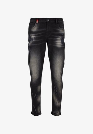 Jeans din denim negre cu o croială slim, detalii uzate, decolorare subtilă și un etichetă roșie pe talie. Design cu cinci buzunare.