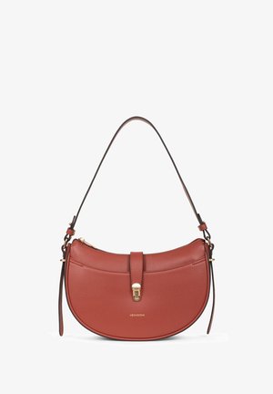 Red leather handbag with a curved shape, gold hardware, top zip closure, and a decorative strap. Features a logo on the front.