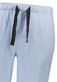 Sinivalkoiset raitapaita-housut, joissa on joustava vyötärö, musta nyöri valkoisilla yksityiskohdilla ja näkyvät sivutaskut.