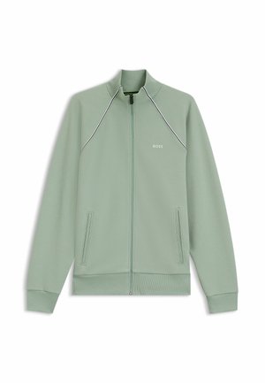 Hellgrüne Jacke mit Reißverschluss, hohem Kragen, gerippten Bündchen und zwei Seitentaschen. Mit kontrastierenden weißen Nähten und einem Logo auf der Brust.