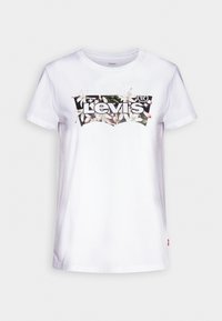 Bílý bavlněný tričko s černou a květinovou grafikou a logem "Levi's". Krátké rukávy a kulatý výstřih dokončují design.