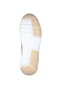 Suela de una zapatilla Nike con un tread de goma blanca y beige que presenta patrones de agarre rectangulares y texturizados.