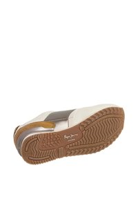 Sneaker with a beige, silver, and brown color scheme. Features textured tan accents, a rubber sole with a patterned tread, and branded logo.