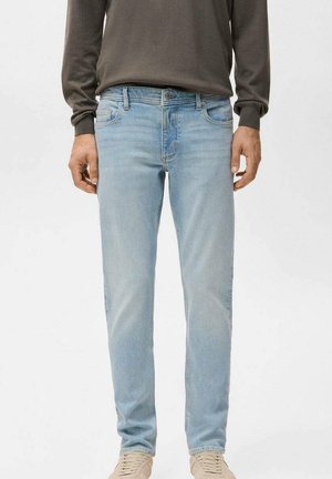 Light blue denim jeans with a straight fit, five-pocket design, and a subtle faded texture. Worn with a gray long-sleeve shirt and light shoes.