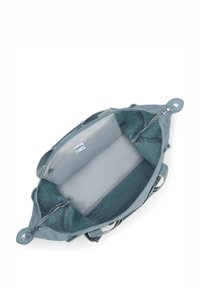 Blue nylon handbag with a zippered opening, featuring a spacious interior and a gray padded compartment for laptops or tablets.