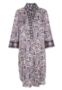 Długa tunika zapinana na guziki w wielokolorowy wzór liści, z kołnierzem na stojąco i rękawami do łokcia z kontrastowymi wykończeniami.