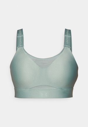 Hele rohelise värvi treeningbra, mis on valmistatud siledast kangast, millel on reguleeritavad rihmad ja ees võrgupaneel hingavuse tagamiseks. Ikooniline logo rihmadel.