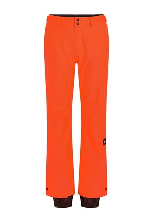 Orange waterproof pants with a relaxed fit, featuring a black waistband, snap closure, and brown accents at the hem, designed for outdoor activities.