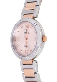 Festina kvarca pulkstenis ar apaļu sudraba un rozā zelta nerūsējošā tērauda korpusu. Rozā ciparnīca ar romiešu skaitļiem un kristāla marķieriem. Metāla saite.