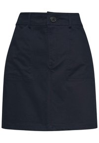 Mörkblå kjol gjord av bomullsblandning med en strukturerad design, framfickor, en synlig knapp och kontrasterande söm längs kanterna.