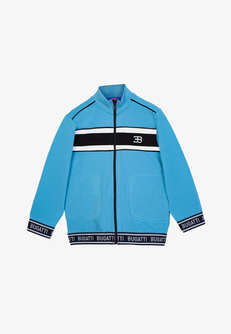 Giacca blu con zip e colletto alto, caratterizzata da strisce orizzontali bianche e nere e due tasche frontali. Include una vita nera con logo.