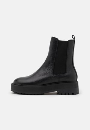 Enkellaarsjes met plateauzool - black