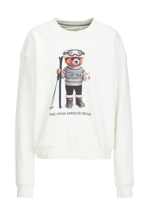 White sweatshirt featuring a graphic of a bear in skiing attire, holding skis and a drink. Text reads "CORTINA" and "THE 19V69 APRÈS SKI BEAR."