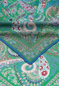 Green scarf with intricate floral and paisley patterns. Features blue edges and a soft, textured fabric. Various colors include red, blue, and pink.