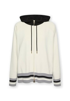 Sudadera con capucha y cremallera en crema con capucha negra a contraste. Presenta un dobladillo a rayas en gris y negro, cordones ajustables y cremallera de metal.