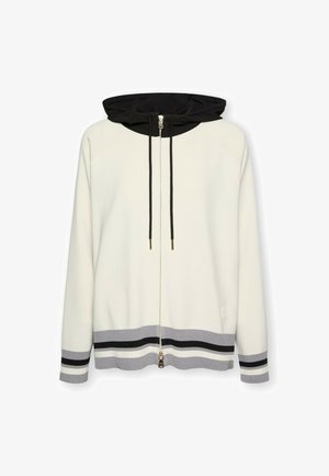 Capuchontrui met rits in crème met contrasterende zwarte capuchon. Voorzien van grijs-zwart gestreepte zoom, verstelbare trekkoorden en metalen rits.
