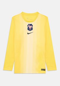 Hosszú ujjú sárga mez függőleges csíkokkal, elöl egy kék pajzs logóval, amely egy kakast ábrázol, valamint egy fekete Nike logóval.