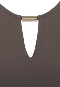 Brown ribbed fabric top featuring a deep V-neckline at the back and a metallic accent near the neck. Smooth texture and fitted design.