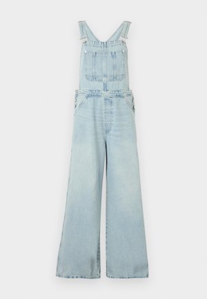 Ανοιχτό μπλε τζιν φορμάκι με φαρδιές παντελόνιες, ρυθμιζόμενους ιμάντες ώμου, μπροστινή τσέπη στο στήθος και πλευρικά κουμπώματα.