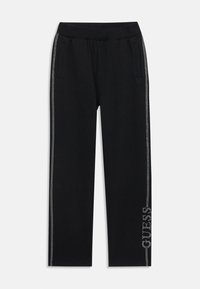 Schwarze Jogginghose mit seitlichen Taschen, elastischem Bund, silbernen Details an der Seite und Logo-Applikation nahe dem Saum.