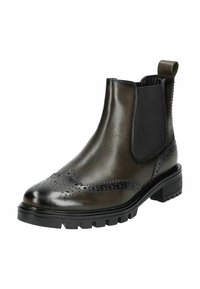 Botas Chelsea de cuero negro con detalles de brogue, paneles laterales elásticos y suela de goma texturizada. Cuenta con una lengüeta para facilitar la puesta.