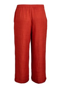Red, lightweight, woven pants with an elastic waistband; loose fit, straight legs, and a textured surface. No pockets or embellishments.