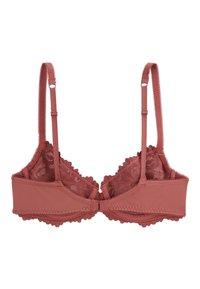 Soutien-gorge en dentelle rose avec des bords festonnés, fines bretelles réglables et un système de fermeture à l'arrière. Présente un motif floral en dentelle sur les bonnets.