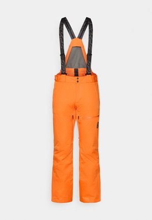 Pomerančové nepremokavé lyžiarske nohavice s čiernymi nastaviteľnými trakovými popruhmi, zipsovou vreckom, zapínaním na gombík a voľným strihom.