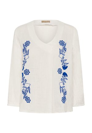 Valge pika varrukaga pluus V-kaelusega, millel on vertikaalsed sinised lillelisi tikandiga mõlemal pool eesmist osa.