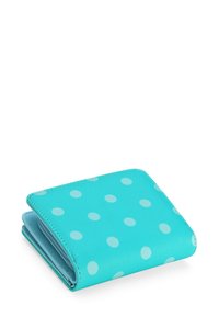 Turquoise wallet with large white polka dots, made of smooth material, folded with visible stitching and a zipper pull on the side.