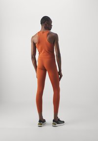 Nike Performance ONE - Leggings - burnt sunrise