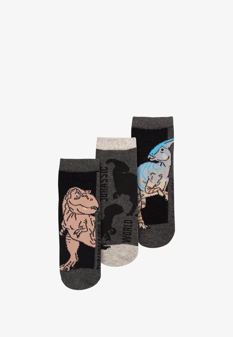 Tre paia di calzini con design di dinosauri. I colori includono nero, grigio e beige; le texture sono in maglia liscia con stampe grafiche.