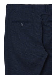 Pantaloni a quadri navy in tessuto testurizzato. Presentano una tasca posteriore singola con bottone e passanti per cintura lungo la vita.