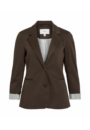 Pruun bleiser, millel on kohandatud lõige, kaks nuppu ja küljetaskud. Omab triibulisi varrukaotsi ja peentriibuline vooder, valmistatud pehmest materjalist.